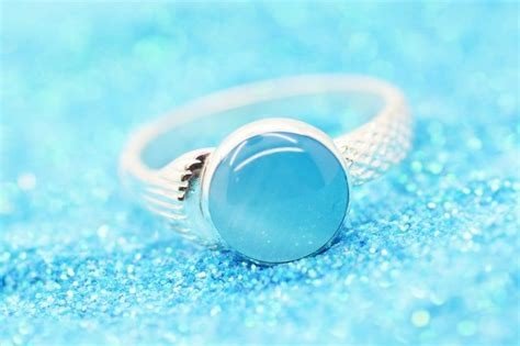 ANILLO PLATA LEY AJUSTABLE OJO DE TIGRE BUDA AZUL