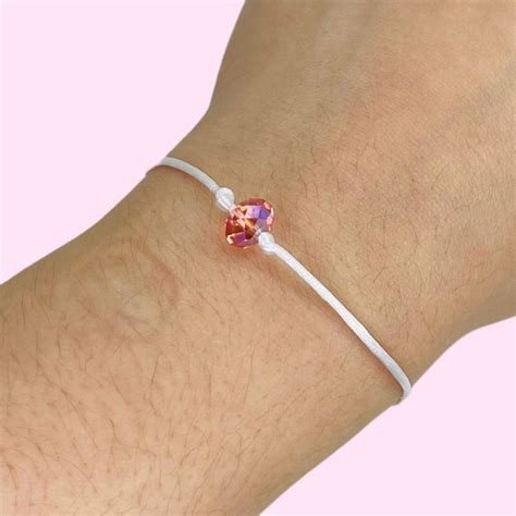PULSERA HILO BLANCO CON CORAZON DE CUARZO ROSA ALURA
